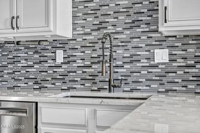 a kitchen with granite countertop a stove and a sink