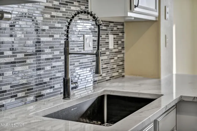a living room with granite countertop furniture and fireplace