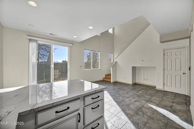 a view of kitchen with microwave and cabinets