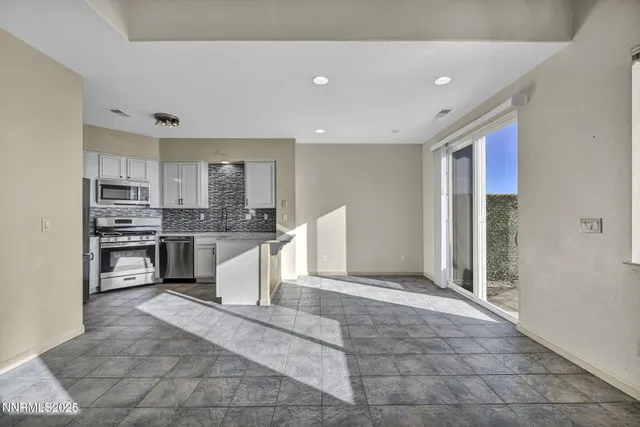 a view of entryway and kitchen