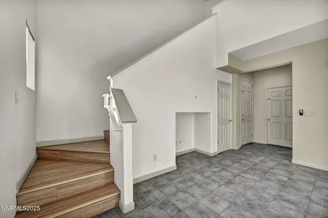 a view of a hallway with stairs