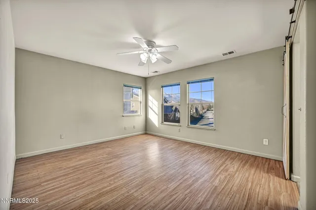a bathroom with a granite countertop sink a mirror and a bathtub