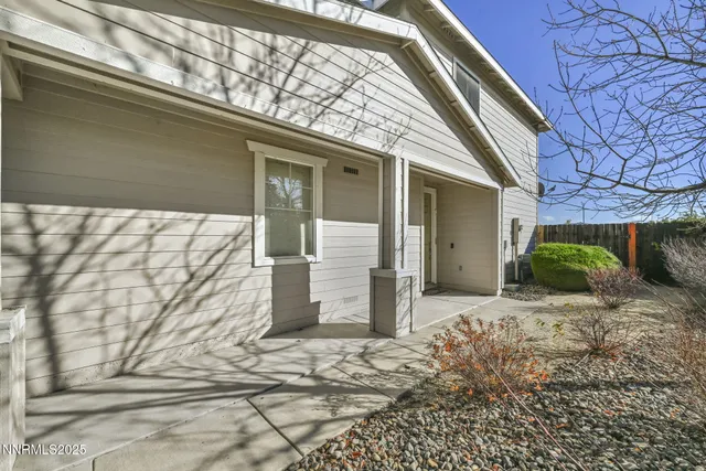 a view of livingroom with hardwood floor and a bathroom