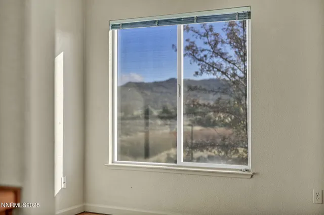 a bathroom with a granite countertop sink toilet a large mirror and shower