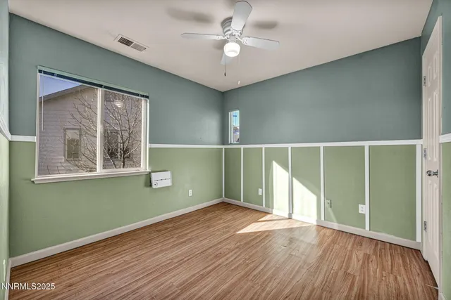 a view of a yard with a tree