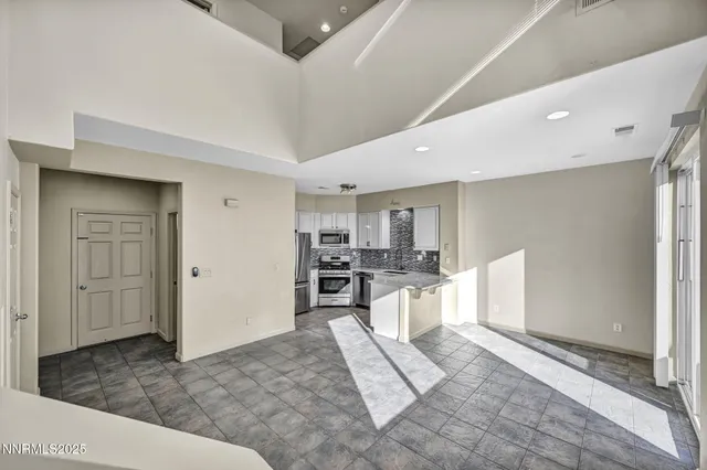 a kitchen with a refrigerator sink and microwave