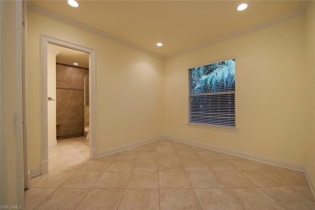 3883 North Road Naples, FL 34104 - Photo 11 of 20 a view of an empty room with a window