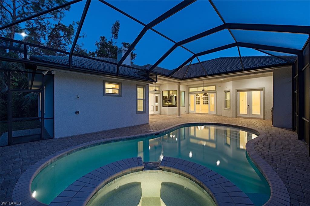 3883 North Road Naples, FL 34104 - Photo 18 of 20 a view of swimming pool with a workspace