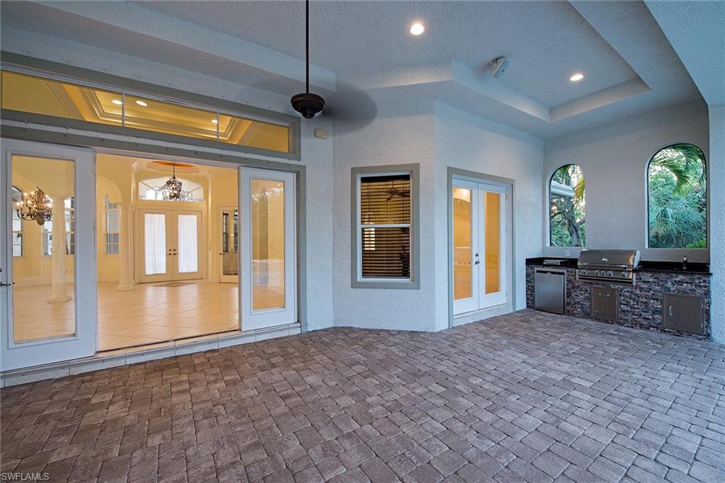 3883 North Road Naples, FL 34104 - Photo 19 of 20 a living room with furniture and a window