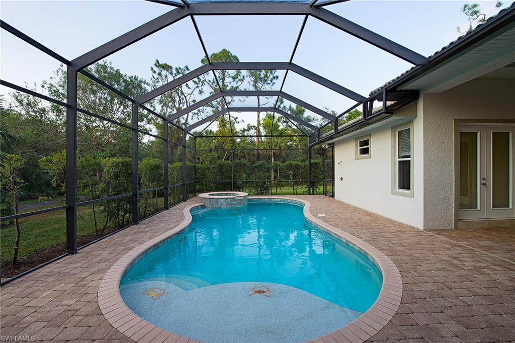 3883 North Road Naples, FL 34104 - Photo 20 of 20 a view of a swimming pool with a patio