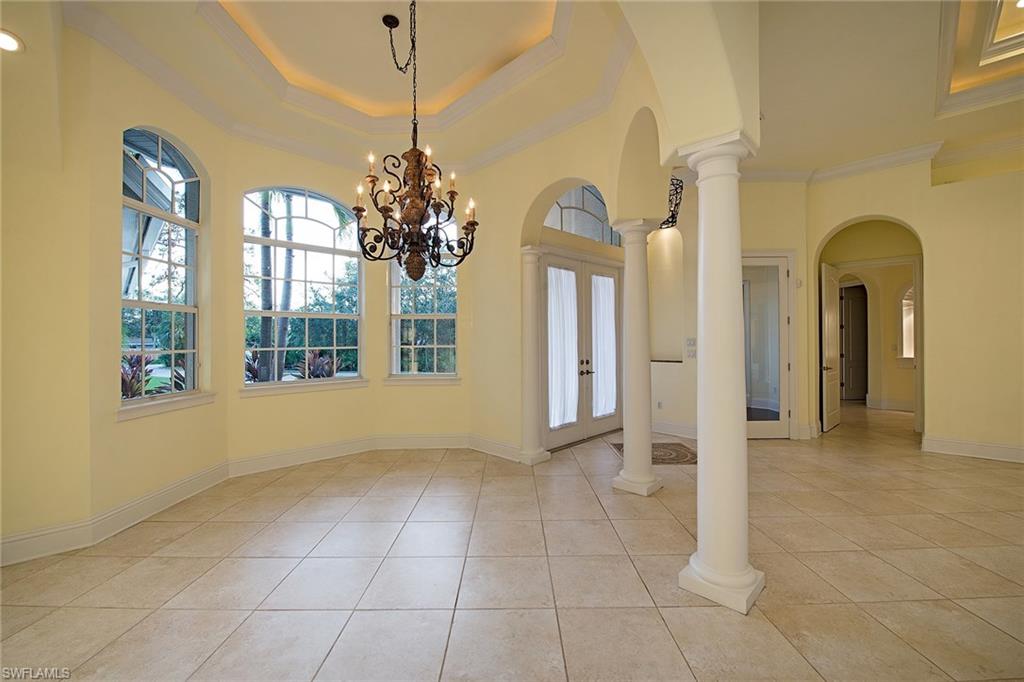 3883 North Road Naples, FL 34104 - Photo 5 of 20 a view of a bathroom with a glass door shower and a sink