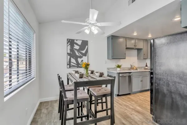 a view of a dining room with furniture and wooden floor