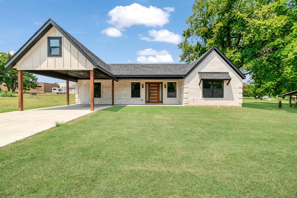 306 Sunset Street Roxton, TX 75477 - Photo 2 of 26 a front view of house with yard and green space