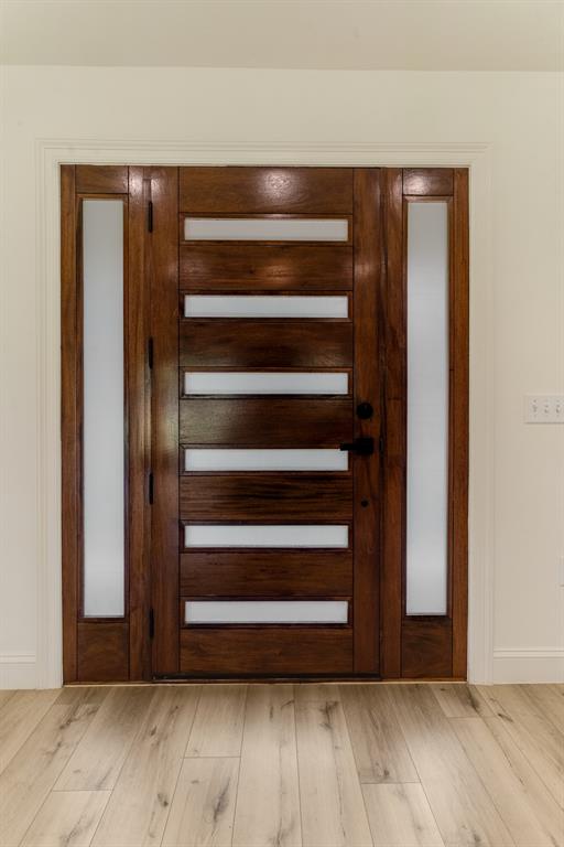 306 Sunset Street Roxton, TX 75477 - Photo 23 of 26 a view of walk in closet with empty racks
