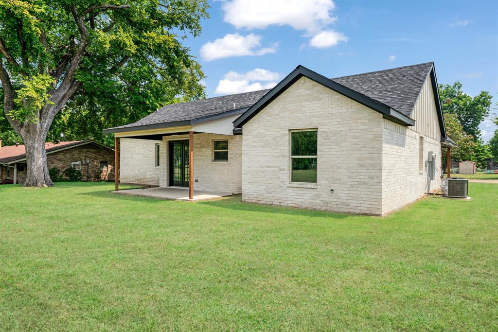 306 Sunset Street Roxton, TX 75477 - Photo 26 of 26 a view of a house with backyard