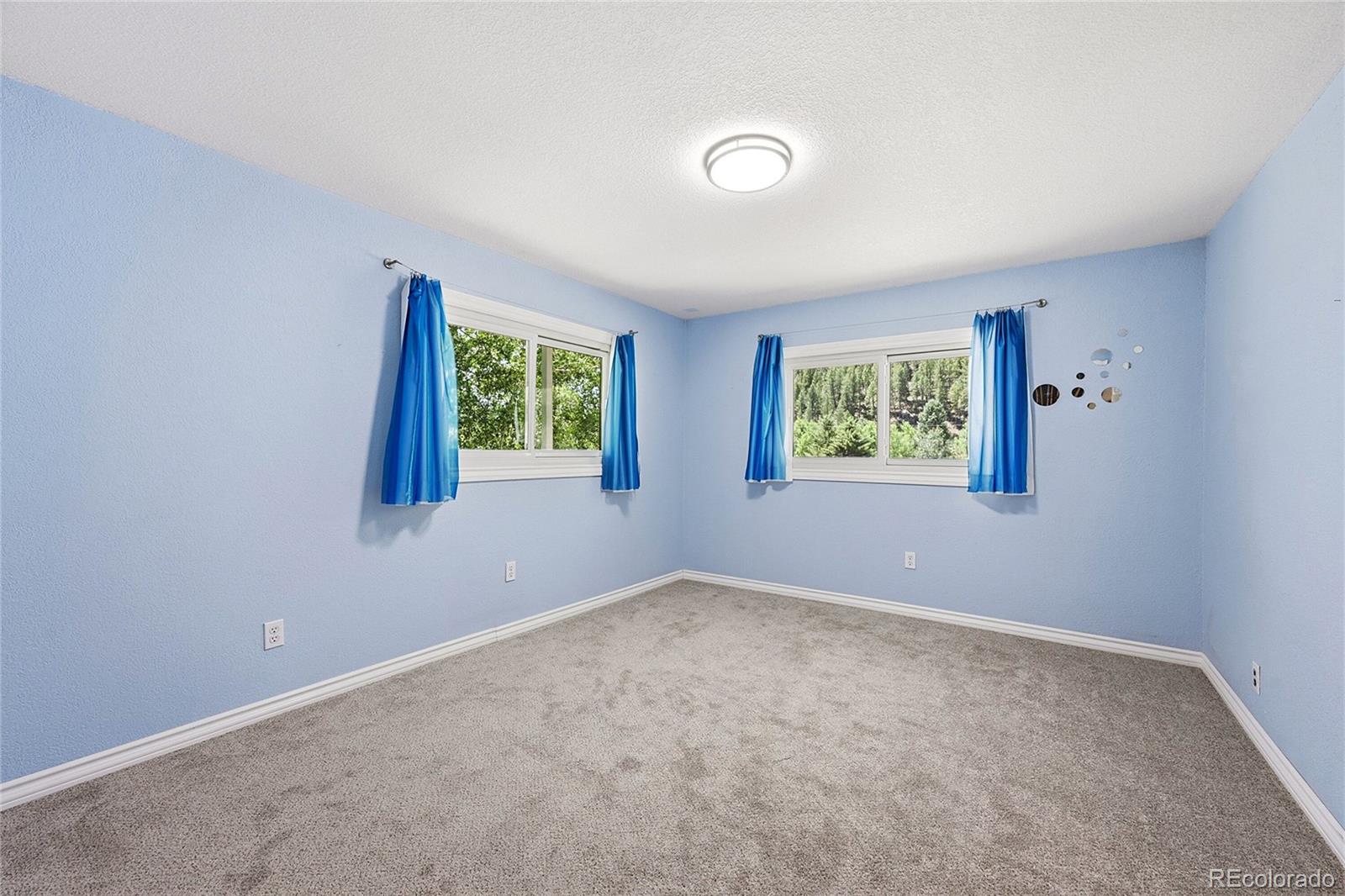 427 Brookside Drive Bailey, CO 80421 - Photo 29 of 37 an empty room with windows