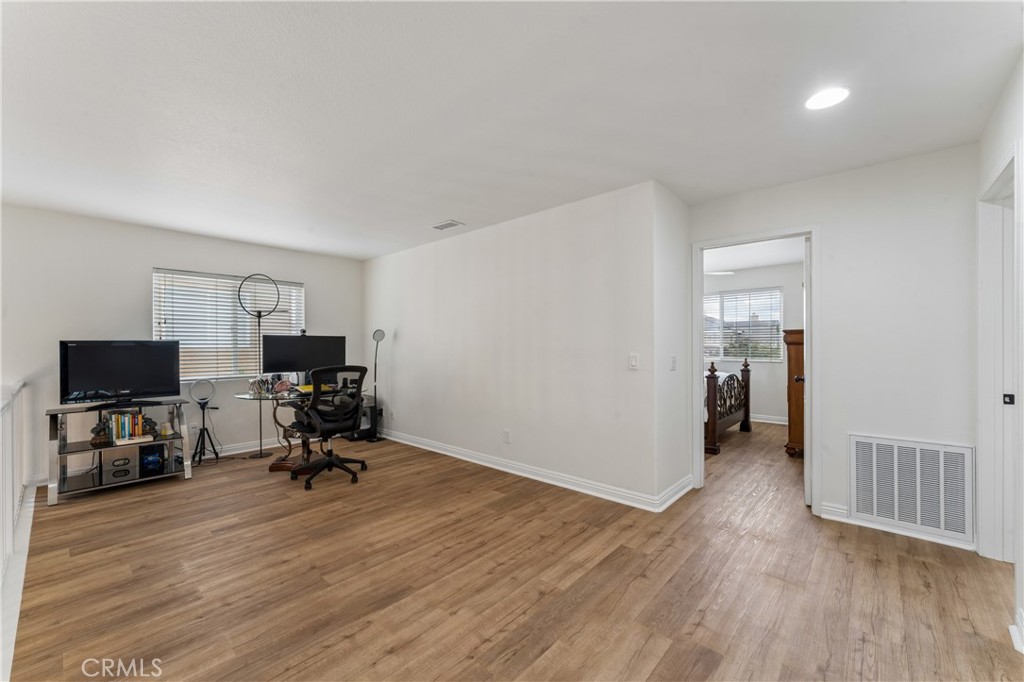 26023 Salinger Lane Stevenson Ranch, CA 91381 - Photo 24 of 35 Spacious loft featuring a dedicated gaming area and a versatile home office space.