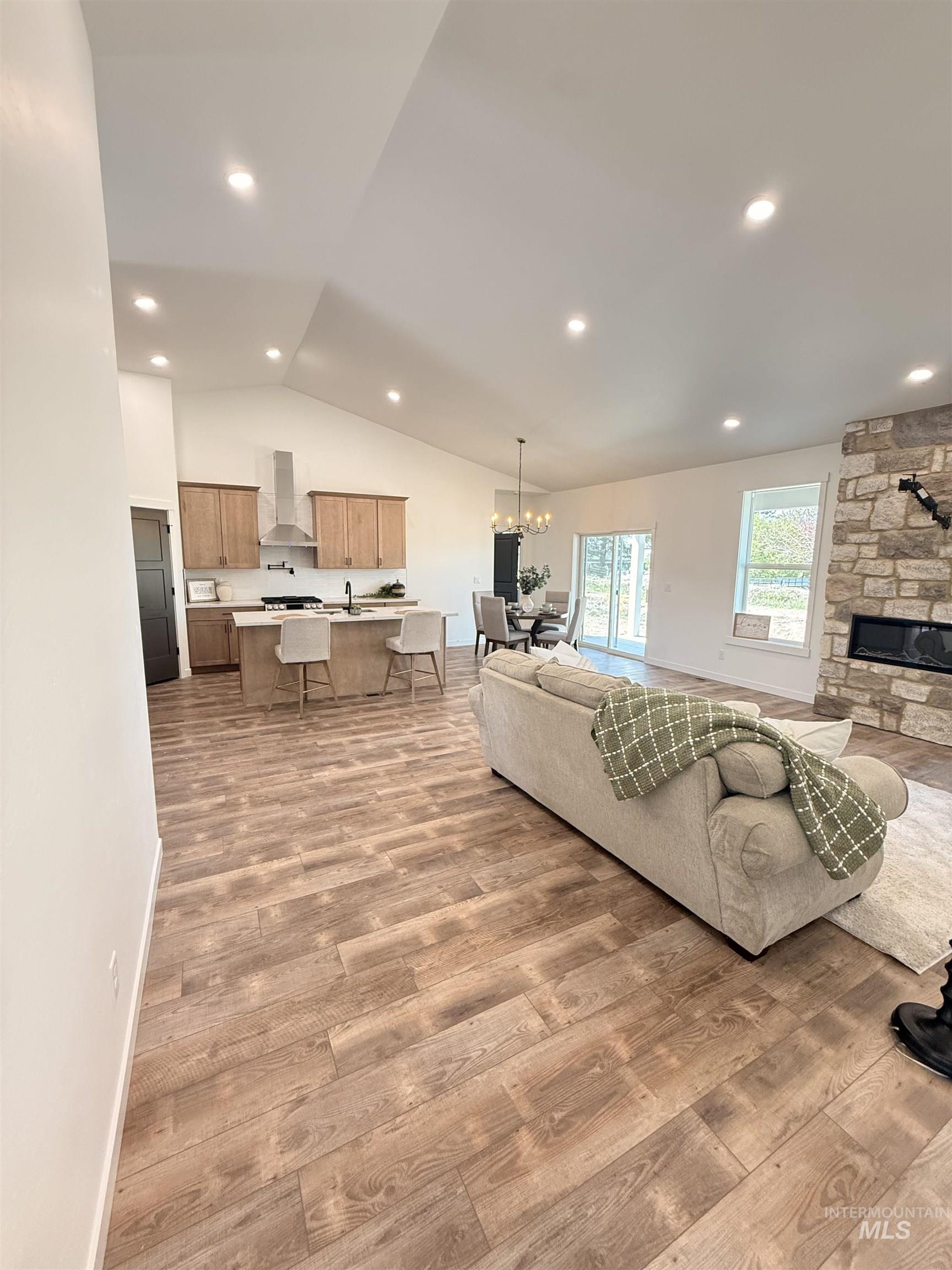 1220 Bronze Rupert, ID 83350 - Photo 14 of 30 Open concept living space featuring vaulted ceilings with recessed lighting