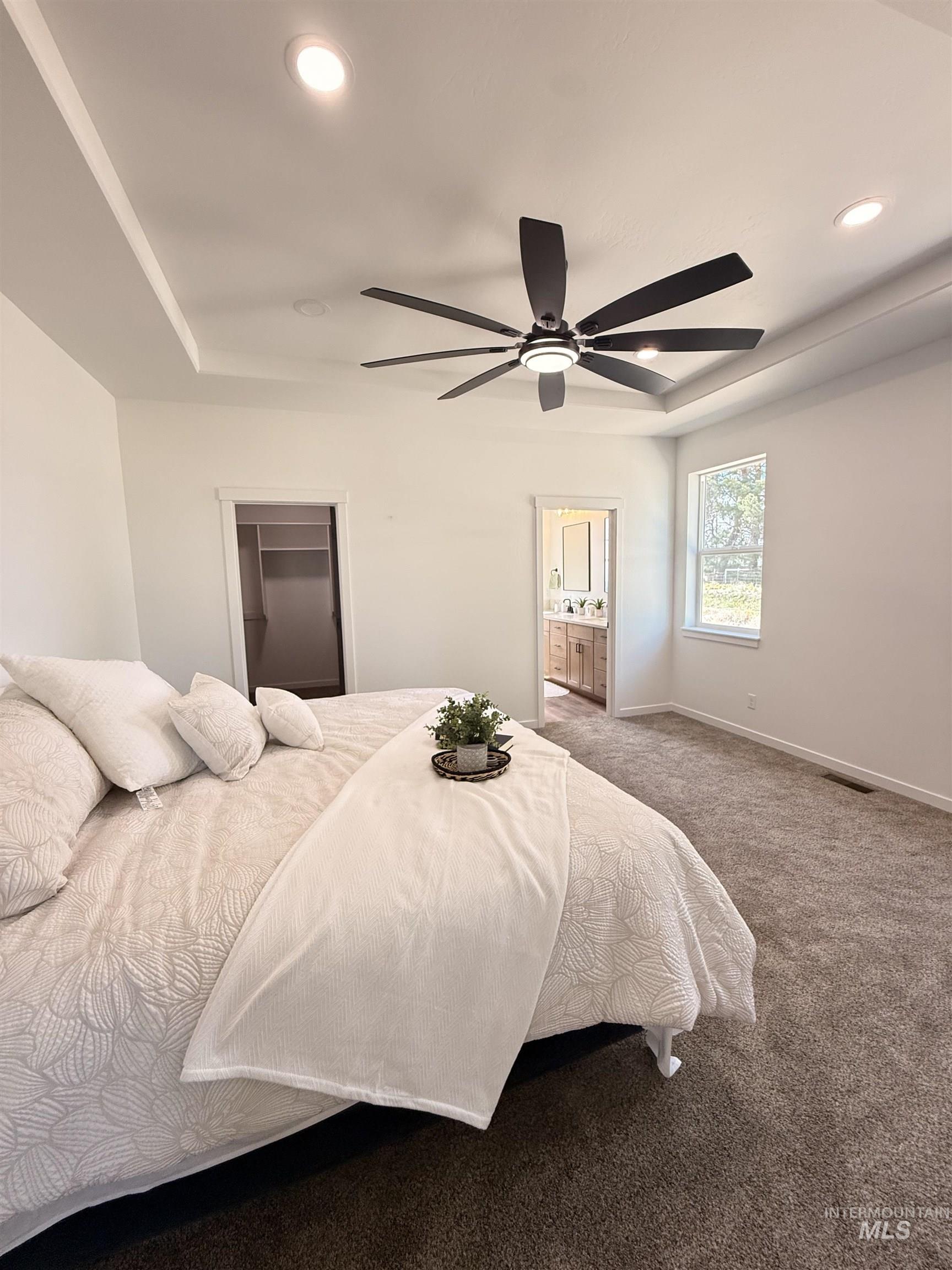 1220 Bronze Rupert, ID 83350 - Photo 17 of 30 Bedroom featuring a tray ceiling with recessed lighting and a contemporary ceiling fan