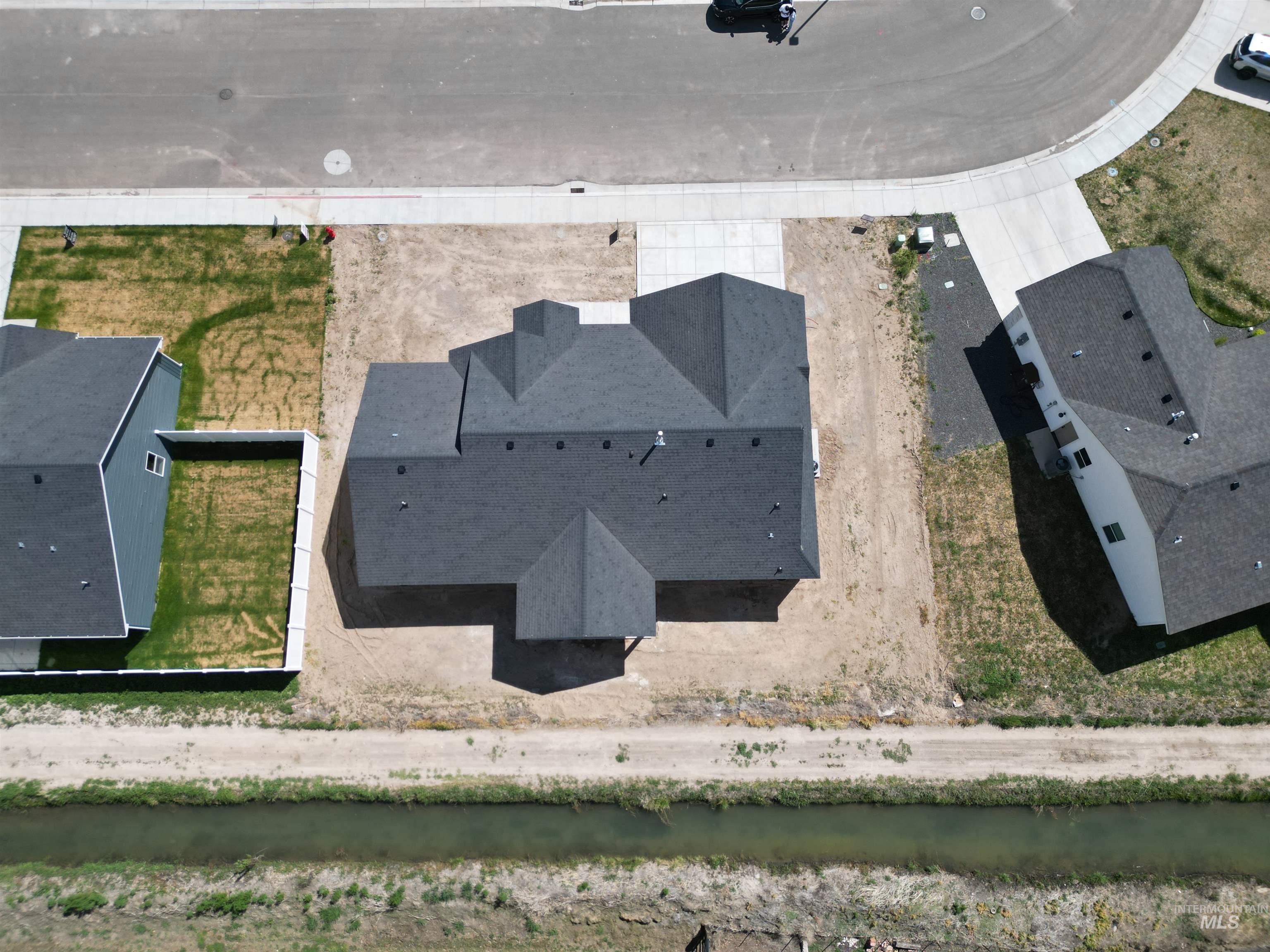 1220 Bronze Rupert, ID 83350 - Photo 27 of 30 Newly constructed residence featuring a multi-gabled roofline and an asphalt shingle roof