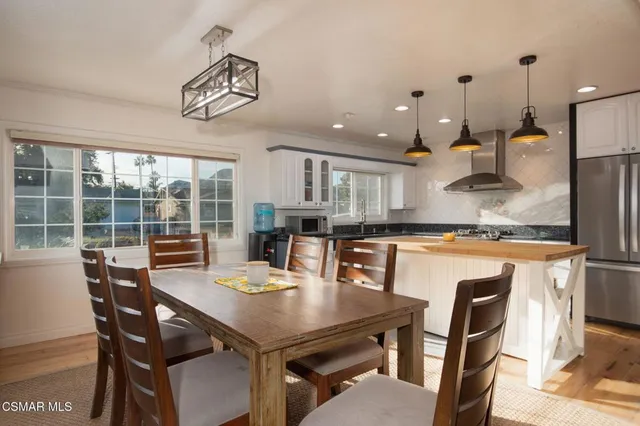 a view of a dining room with furniture window and outside view