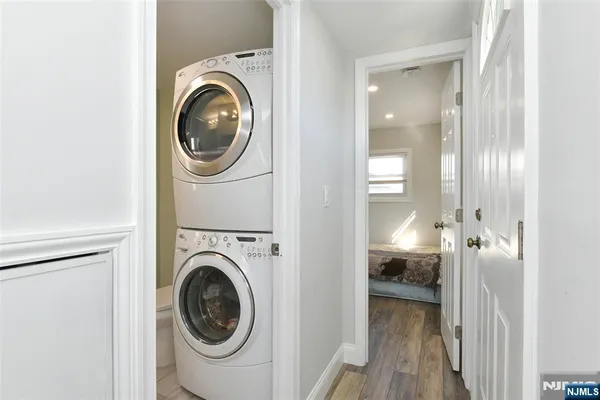 a view of a hallway with washer and dryer