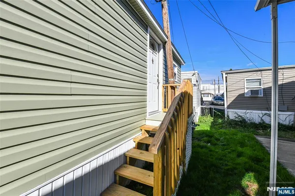 a view of a patio with wooden floor