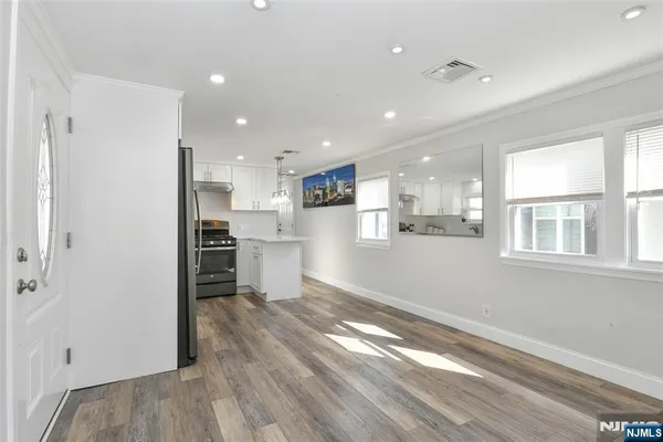 a view of kitchen with wooden floor