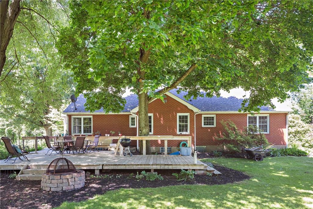 9620 Fox Road Pittsburgh, PA 15237 - Photo 21 of 25 A very large deck extends off the back of the house. A perfect place to entertain, sit by the stone fire pit or listen to the peace and quite of nature.
