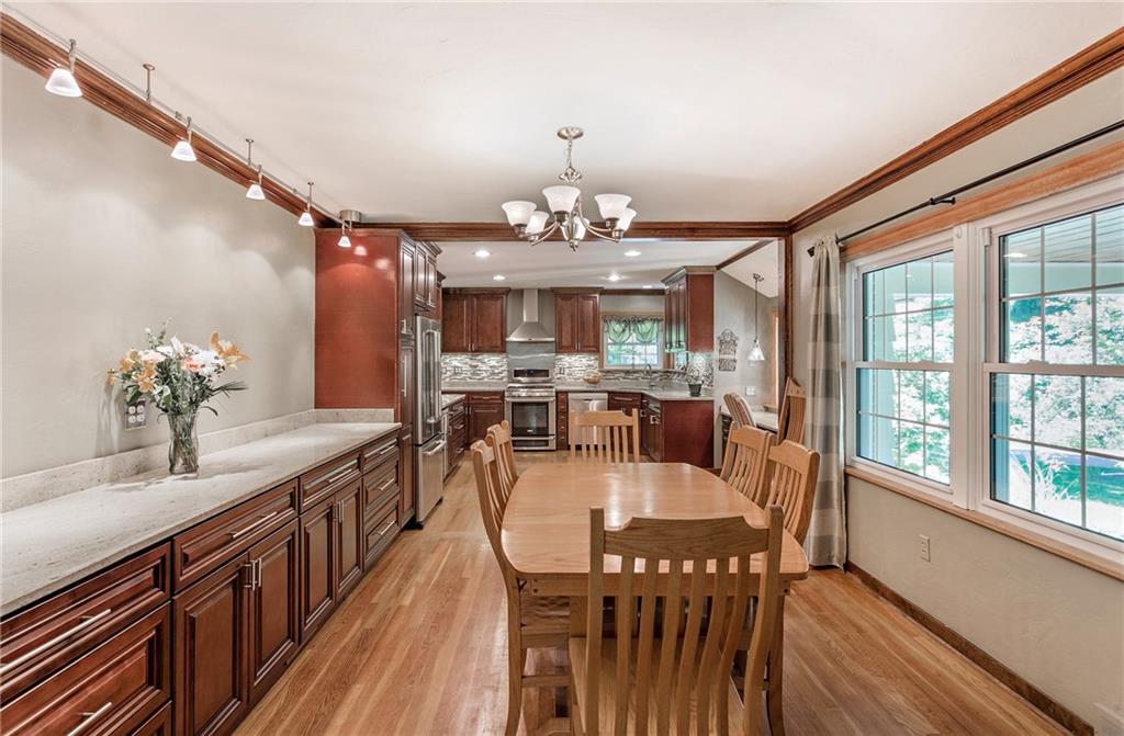 9620 Fox Road Pittsburgh, PA 15237 - Photo 5 of 25 Cherry cabinetry extends into the dining room to provide a ton of storage and a large serving buffet.