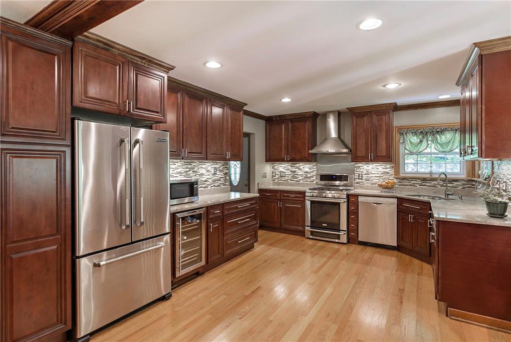 9620 Fox Road Pittsburgh, PA 15237 - Photo 7 of 25 Beautifully updated kitchen with cherry cabinets, stainless appliances and granite counters. Who wouldn't enjoy cooking meals here!