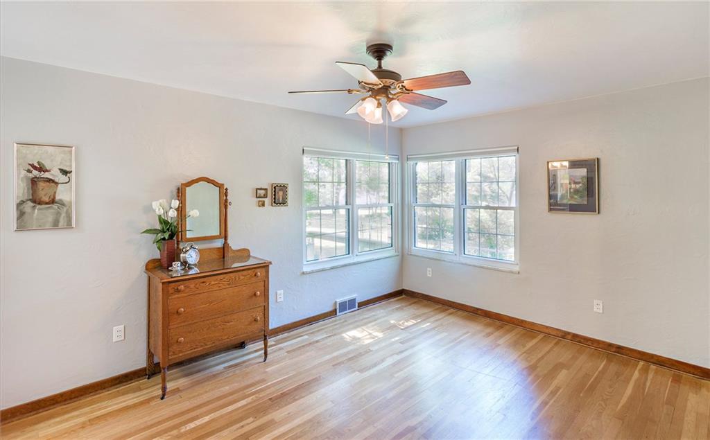 9620 Fox Road Pittsburgh, PA 15237 - Photo 9 of 25 This bedroom has its own powder room, lots of natural light and look at those pretty hardwoods!