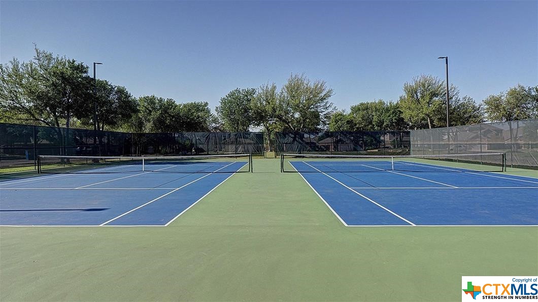 9618 Luke Path Helotes, TX 78023 - Photo 16 of 18 a view of a tennis court