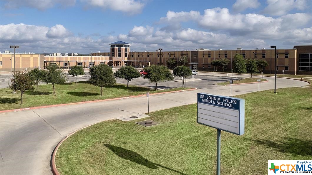 9618 Luke Path Helotes, TX 78023 - Photo 8 of 18 a view of a swimming pool with a yard