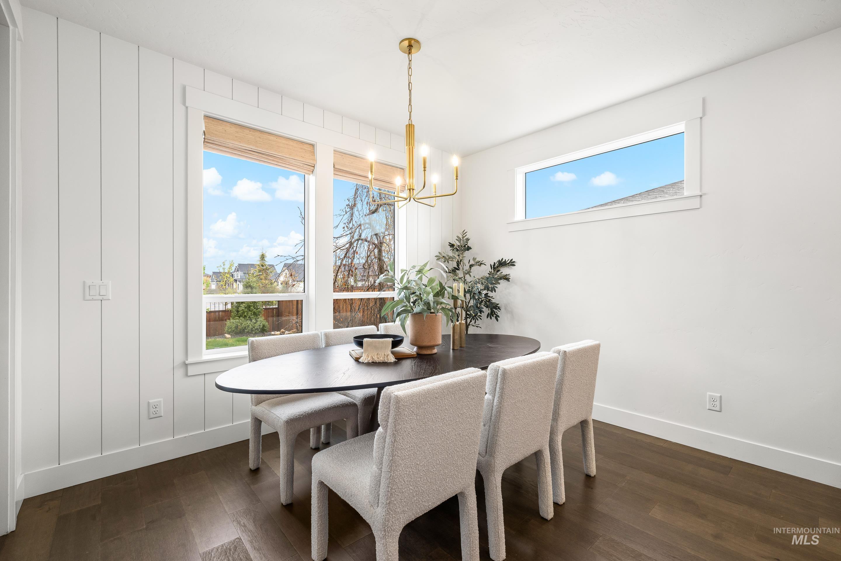 747 South Short Road Eagle, ID 83616 - Photo 18 of 48 Dining space with dark wood-style flooring and suspended lighting