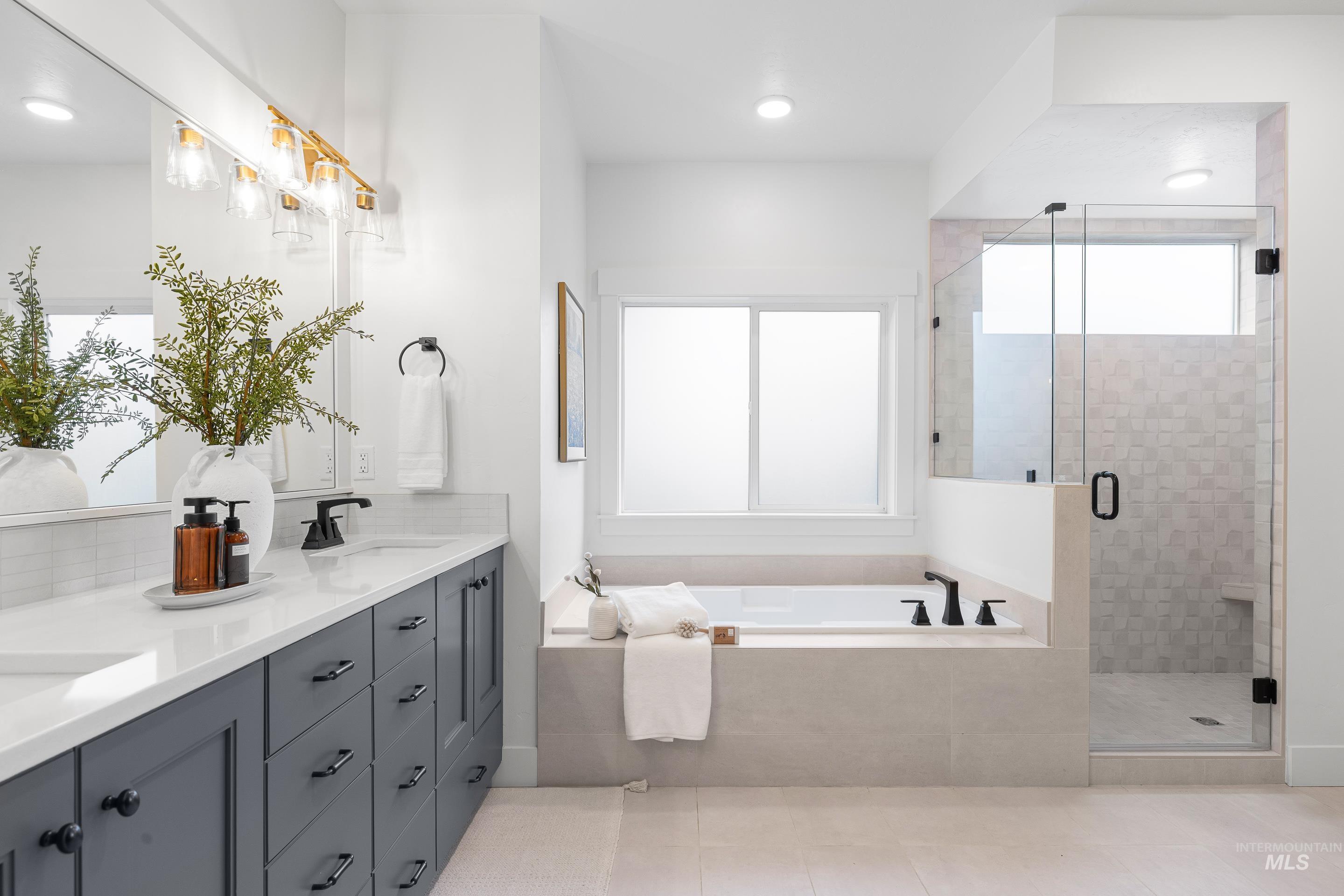 747 South Short Road Eagle, ID 83616 - Photo 24 of 48 Full bath with a stall shower, double vanity, a bath, and recessed lighting