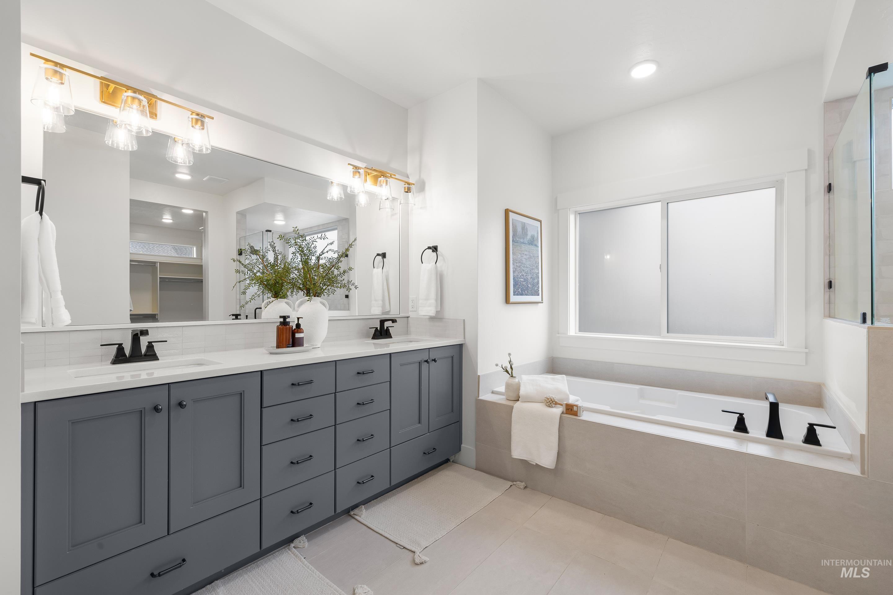 747 South Short Road Eagle, ID 83616 - Photo 25 of 48 Bathroom with double vanity, a bath, light tile patterned flooring, and recessed lighting