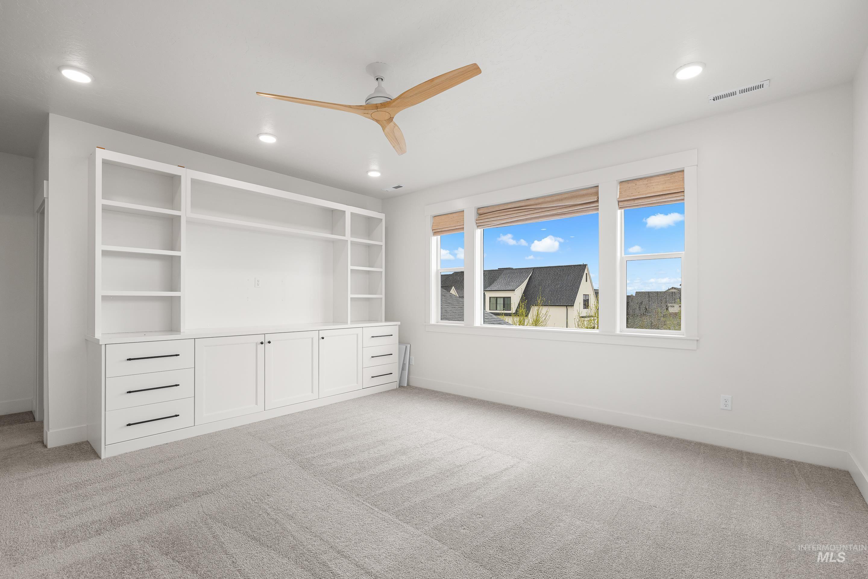 747 South Short Road Eagle, ID 83616 - Photo 31 of 48 Unfurnished bedroom featuring light carpet, a ceiling fan, and recessed lighting