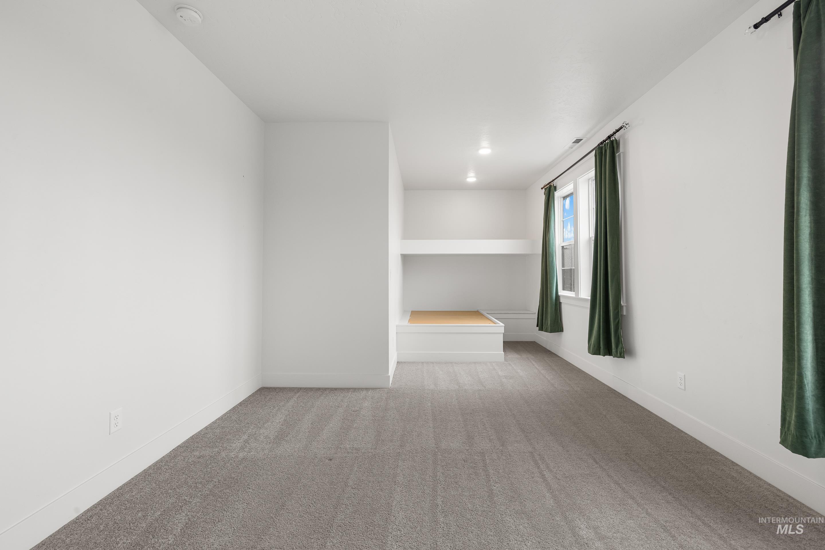 747 South Short Road Eagle, ID 83616 - Photo 37 of 48 Empty room featuring light colored carpet and baseboards