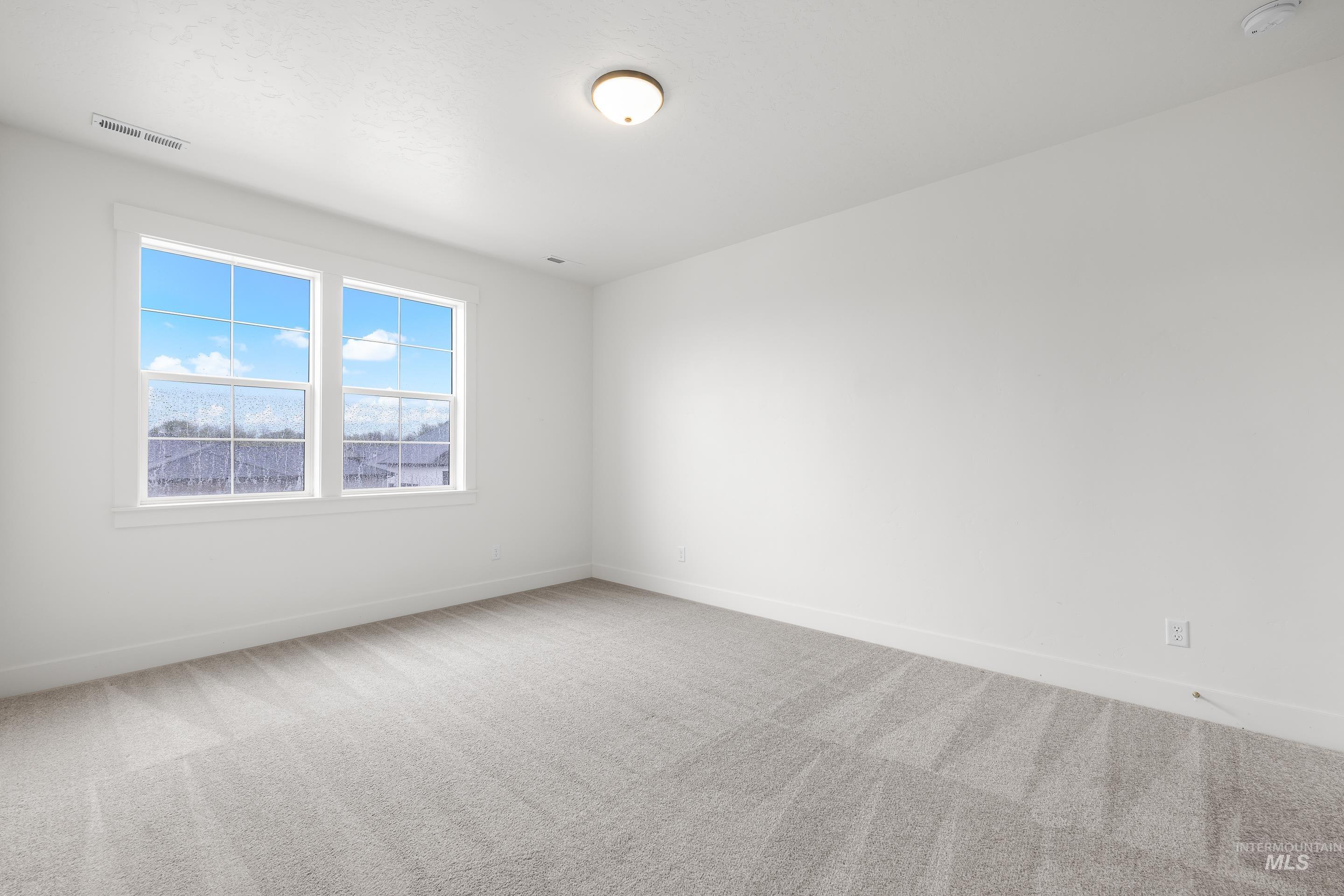 747 South Short Road Eagle, ID 83616 - Photo 38 of 48 Empty room featuring light carpet