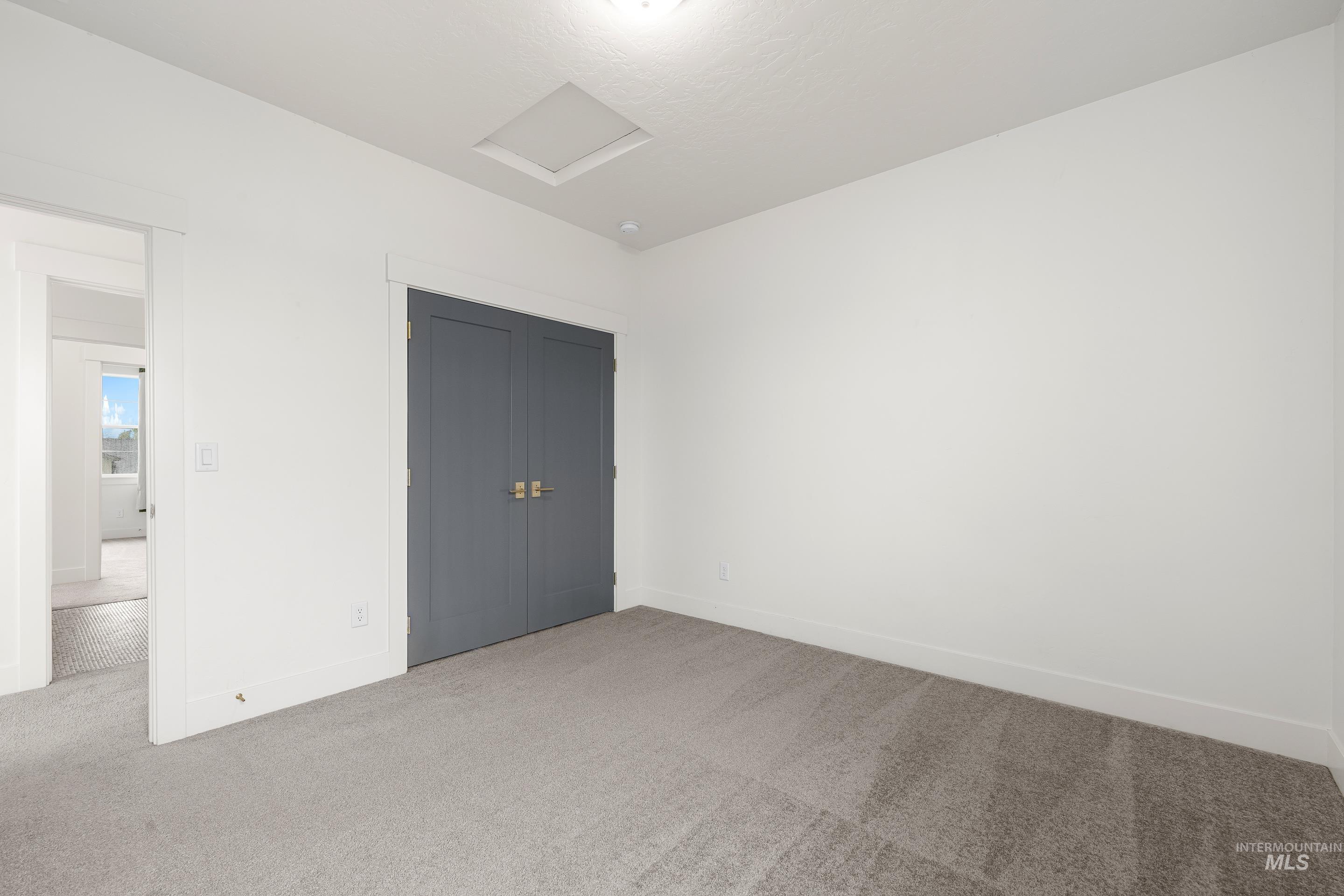 747 South Short Road Eagle, ID 83616 - Photo 39 of 48 Unfurnished bedroom with carpet floors and a closet