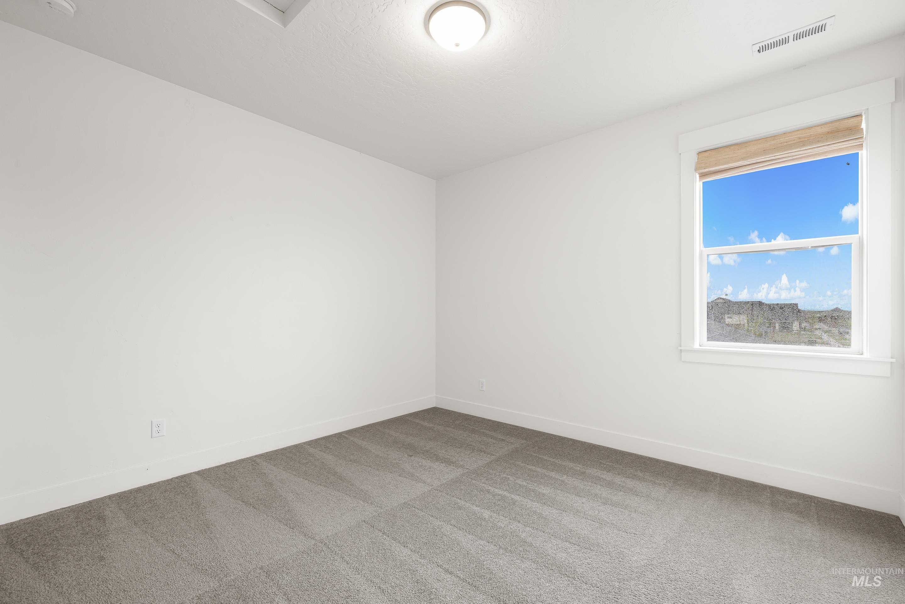 747 South Short Road Eagle, ID 83616 - Photo 40 of 48 Carpeted empty room featuring baseboards