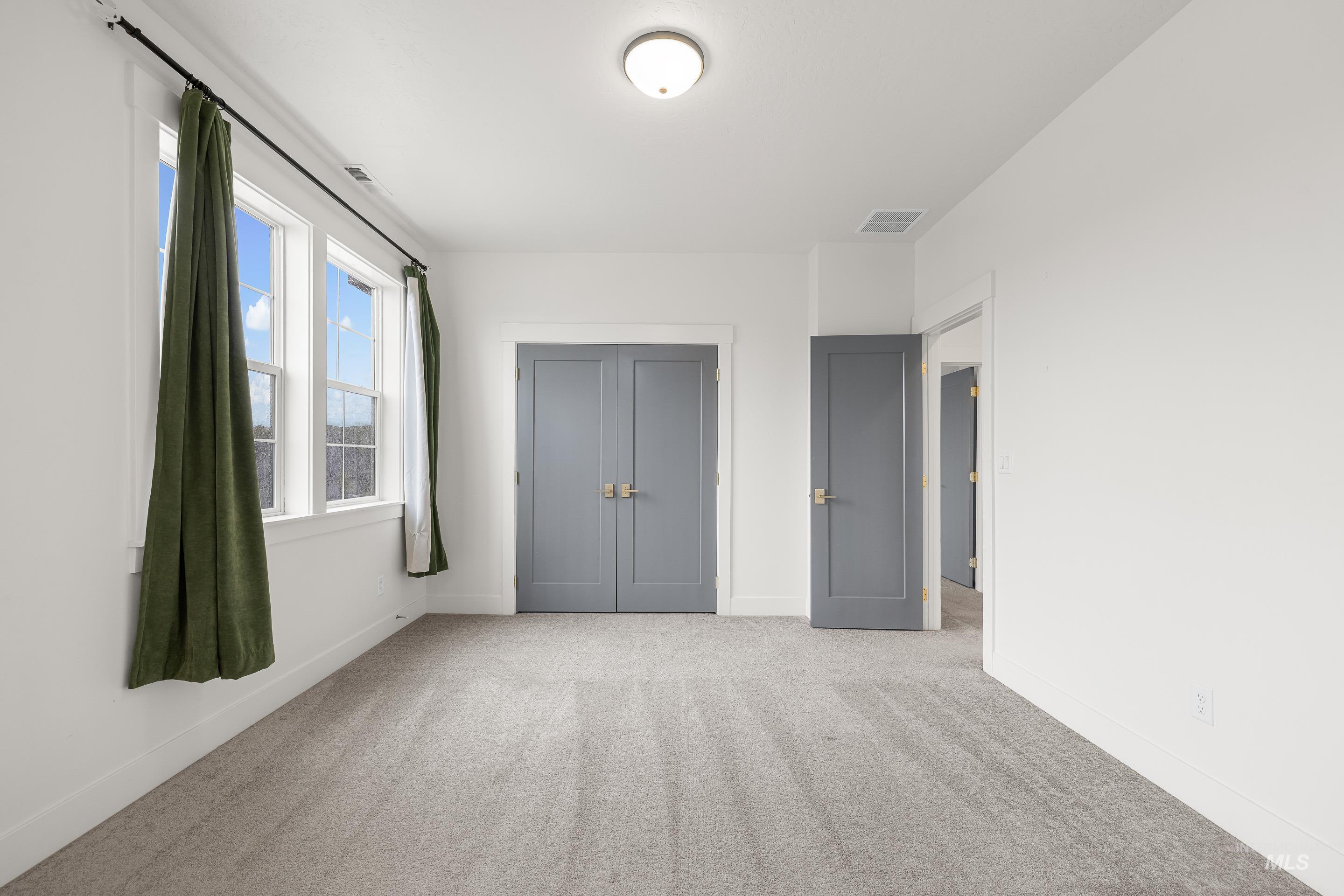 747 South Short Road Eagle, ID 83616 - Photo 41 of 48 Unfurnished bedroom featuring light carpet and a closet
