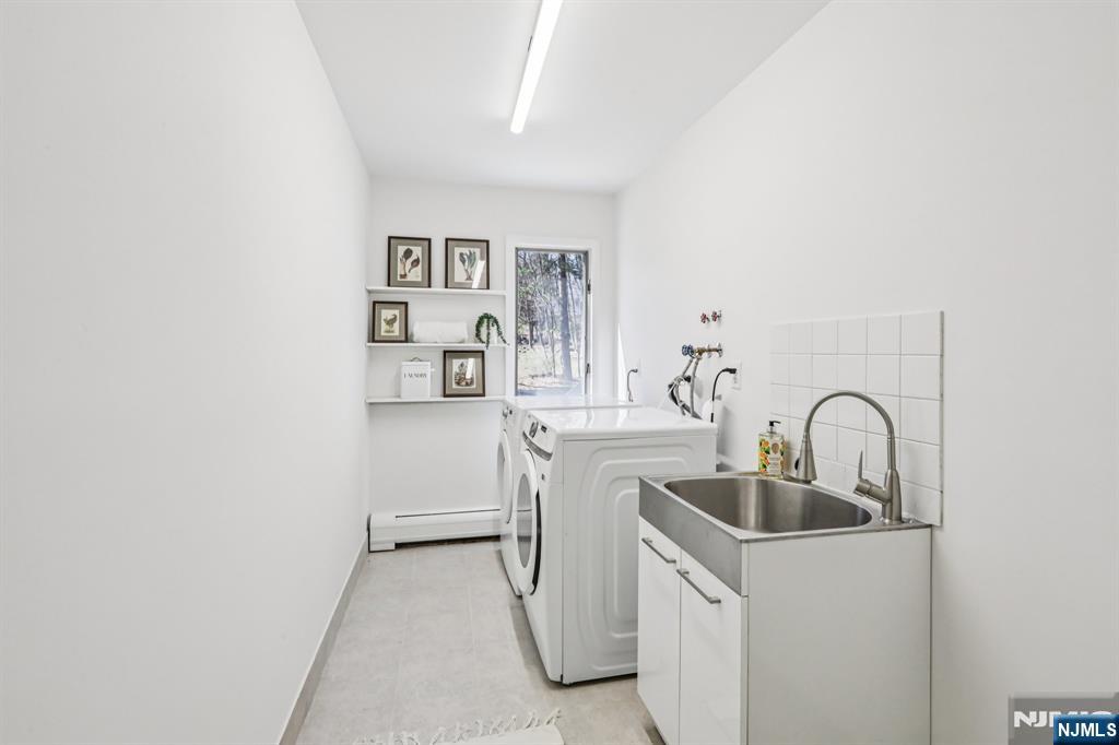 11 Carlough Road Upper Saddle River, NJ 07458 - Photo 26 of 41 a kitchen with a sink and a microwave