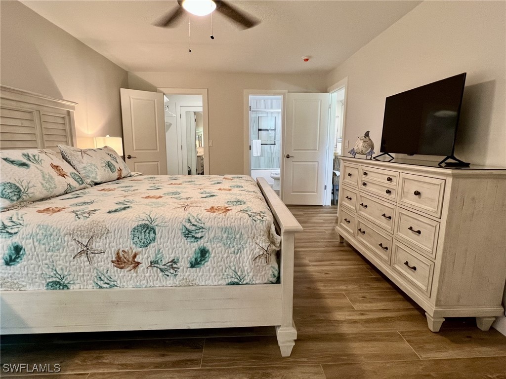5117 Sea Bell Road, Unit F104 Sanibel, FL 33957 - Photo 18 of 41 a living room with furniture and a flat screen tv