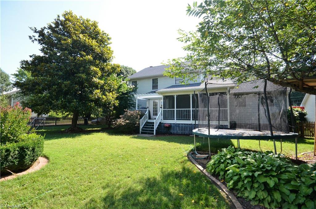 3925 Braddock Road High Point, NC 27265 - Photo 3 of 28 Perfect fenced back yard with professional landscaping, screened in porch to enjoy all your outdoors enjoyment and family time.