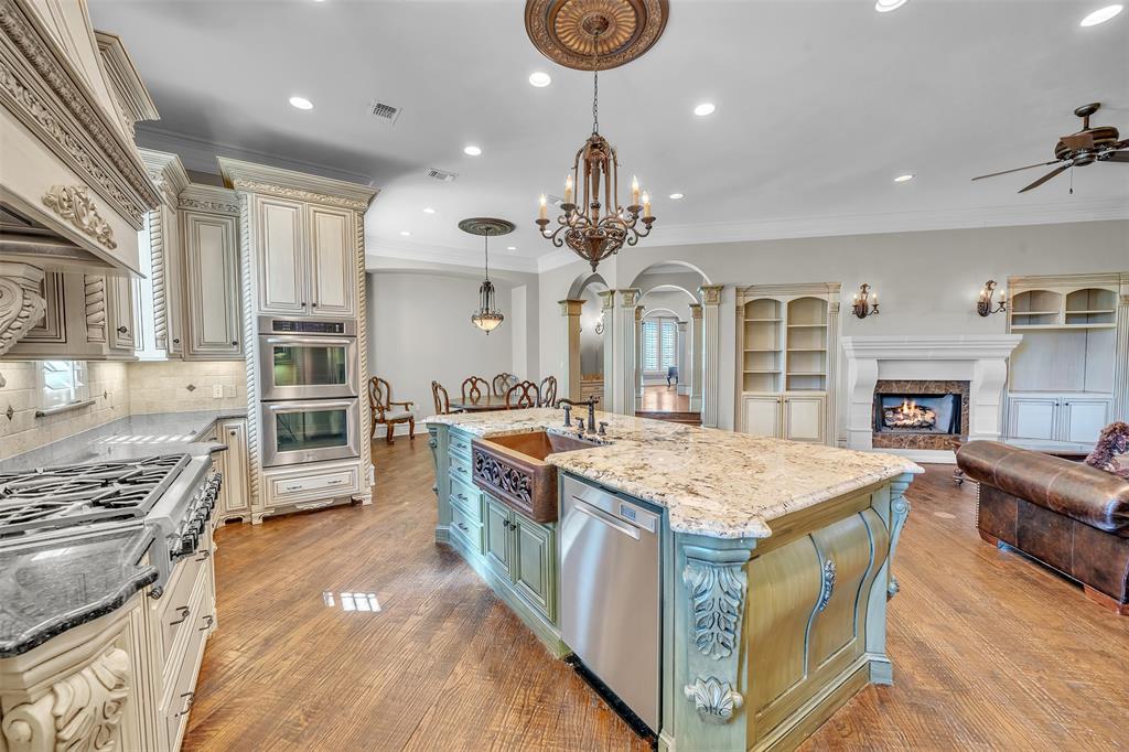 2909 Canyon Creek Drive Sherman, TX 75092 - Photo 40 of 40 a large kitchen with stainless steel appliances granite countertop a stove oven and a refrigerator