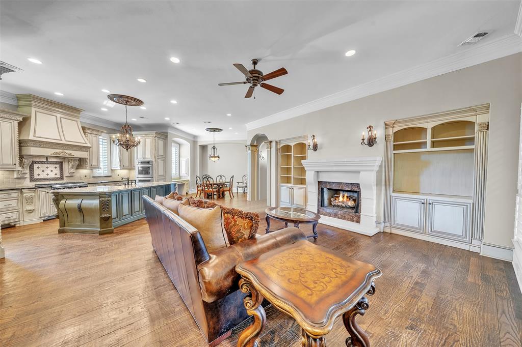 2909 Canyon Creek Drive Sherman, TX 75092 - Photo 13 of 40 a living room with fireplace furniture and a wooden floor