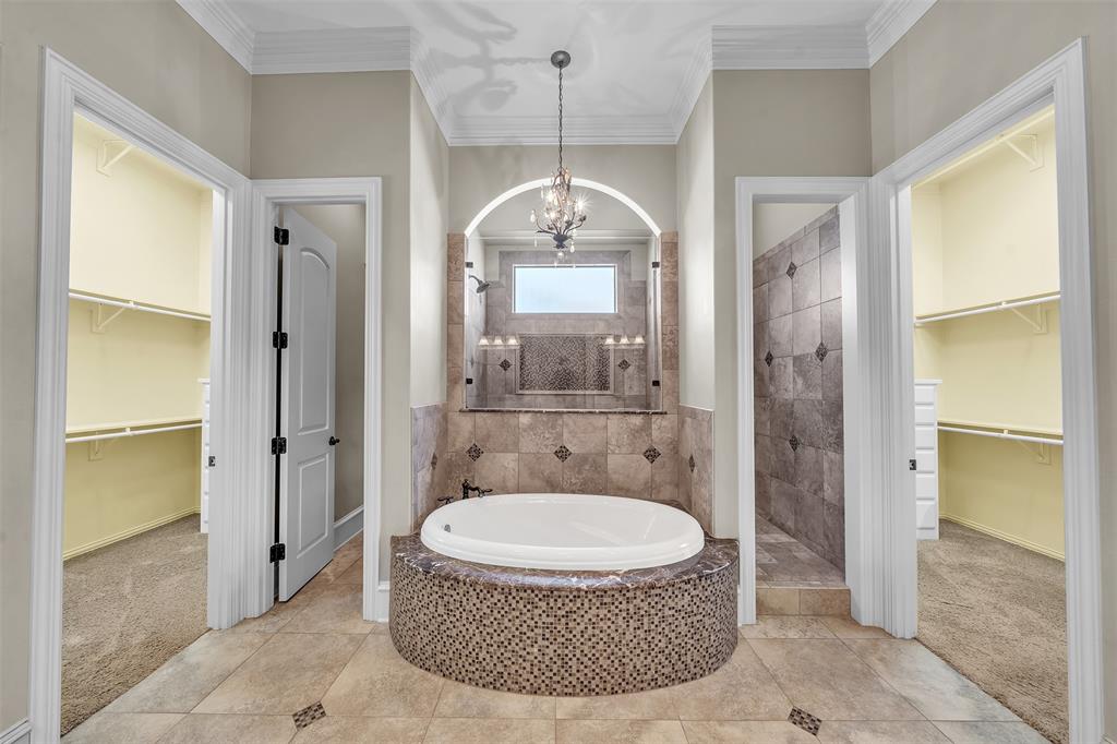 2909 Canyon Creek Drive Sherman, TX 75092 - Photo 17 of 40 a spacious bathroom with a granite countertop shower a sink and a toilet