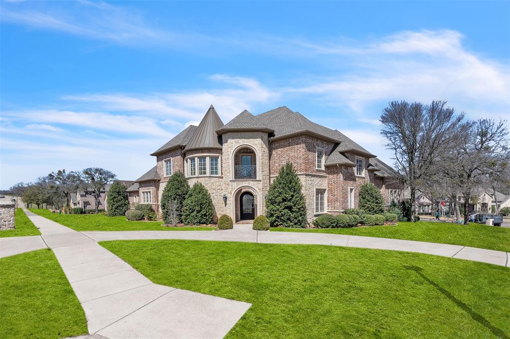 2909 Canyon Creek Drive Sherman, TX 75092 - Photo 2 of 40 a front view of a house with a yard